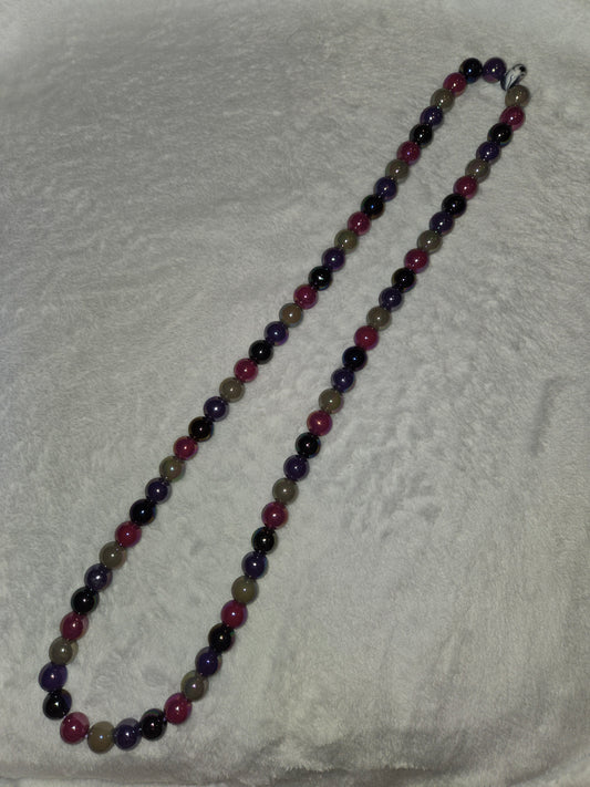 Lanyard with pearlized specialty beads.